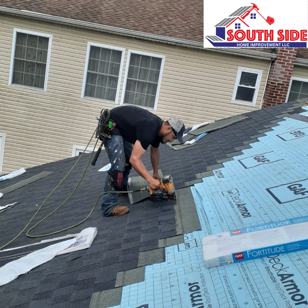 Contractor applying GAF shingles to a new roofing replacement